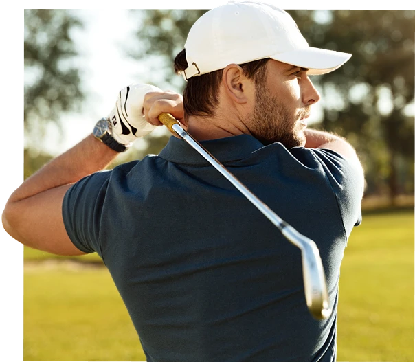 Golfer swinging club